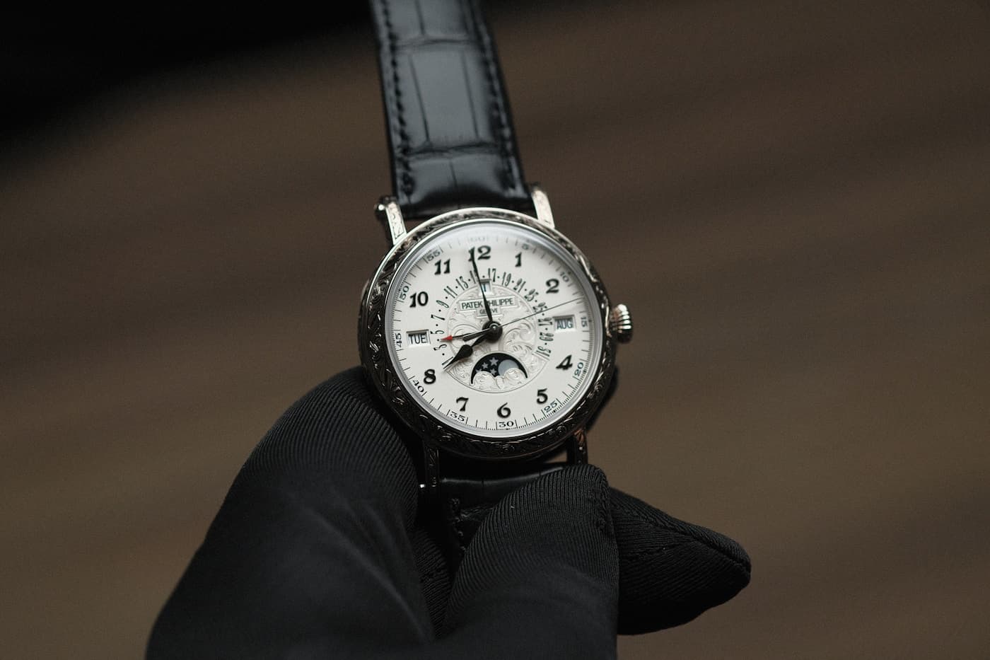 Patek Philippe perpetual calendar with hand-engraved case, white dial with day, month and moonphase